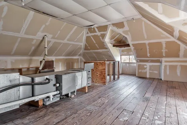a view of backyard with wooden fence