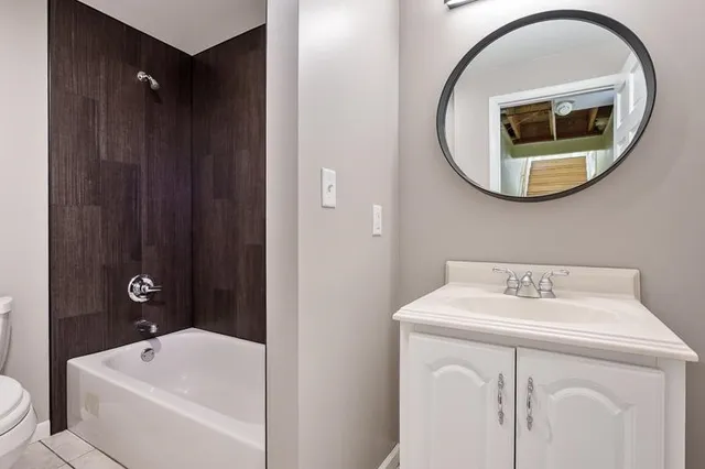 a view of a house with a yard and a fountain