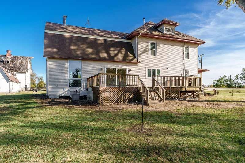 15685 West State Road Pecatonica, IL 61063 - Photo 58 of 69 a view of a house with a yard and a fountain