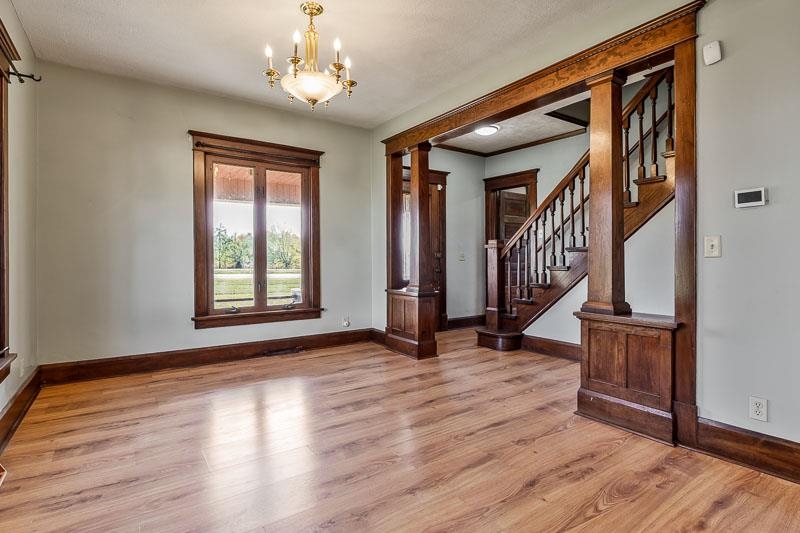 15685 West State Road Pecatonica, IL 61063 - Photo 8 of 69 a view of an empty room with wooden floor and a window