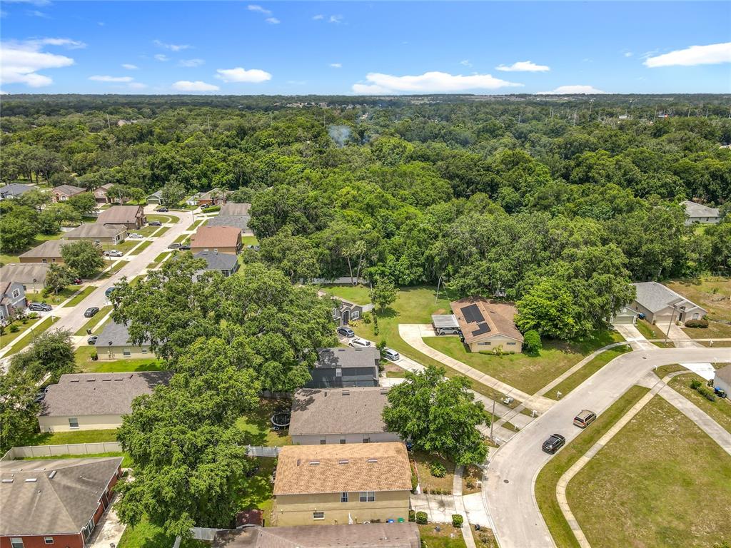 7939 Riffle Lane Orlando, FL 32818 - Photo 48 of 52 an aerial view of residential houses with outdoor space and trees