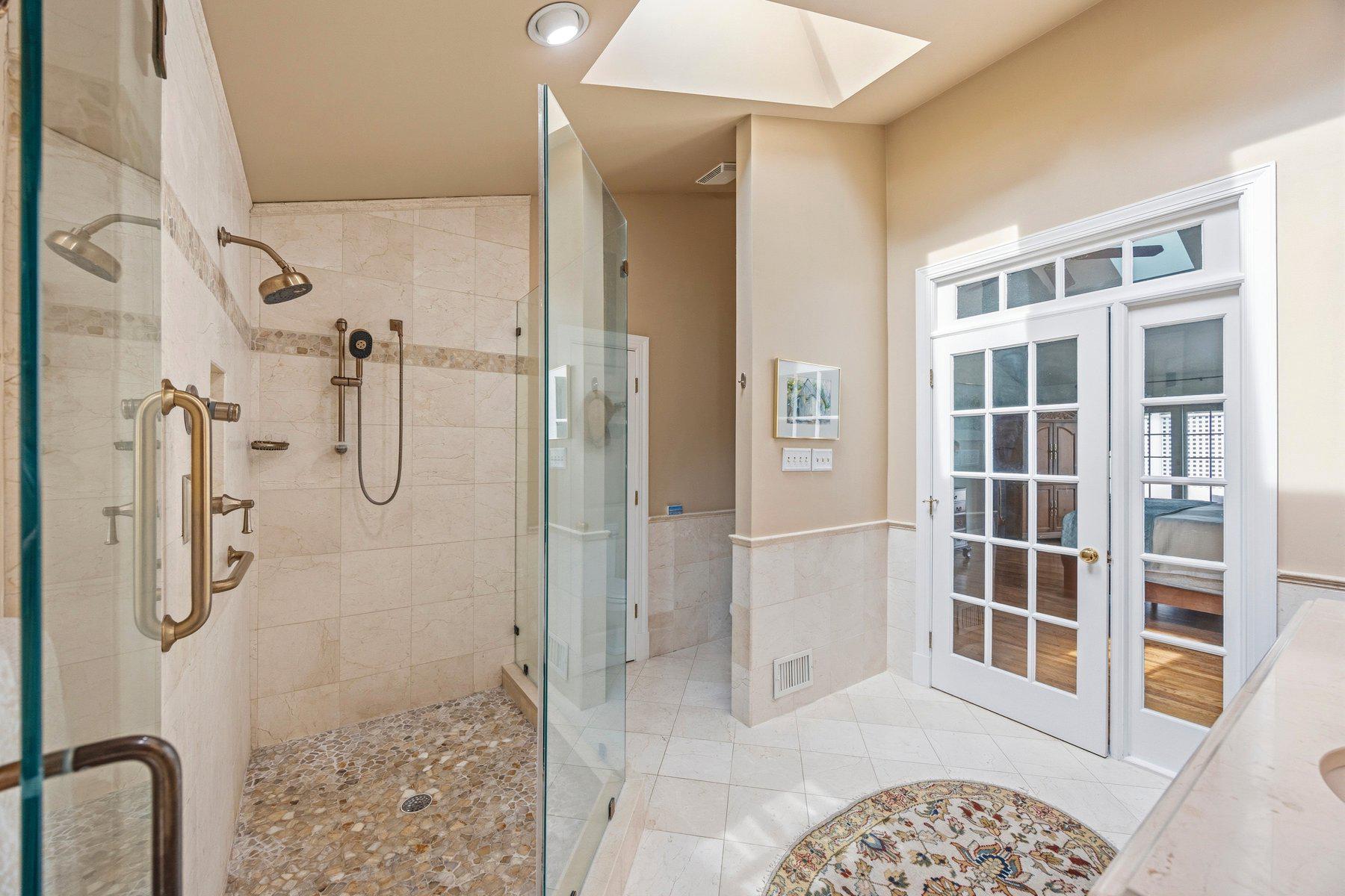 3625 Stansbury Mill Road Phoenix, MD 21131 - Photo 15 of 64 Glass Spa shower with marble tile flooring