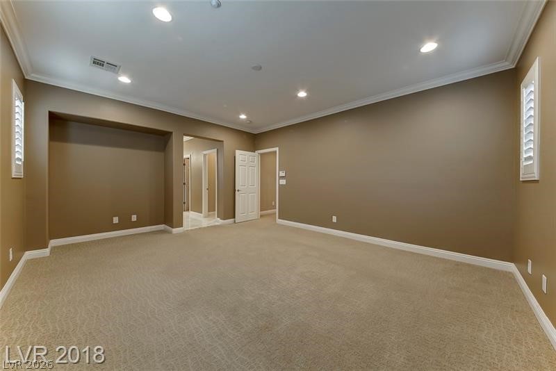 3144 Whitfeild Avenue Henderson, NV 89044 - Photo 21 of 55 A spacious room offers ample space, complete with carpeted flooring and recessed lighting.