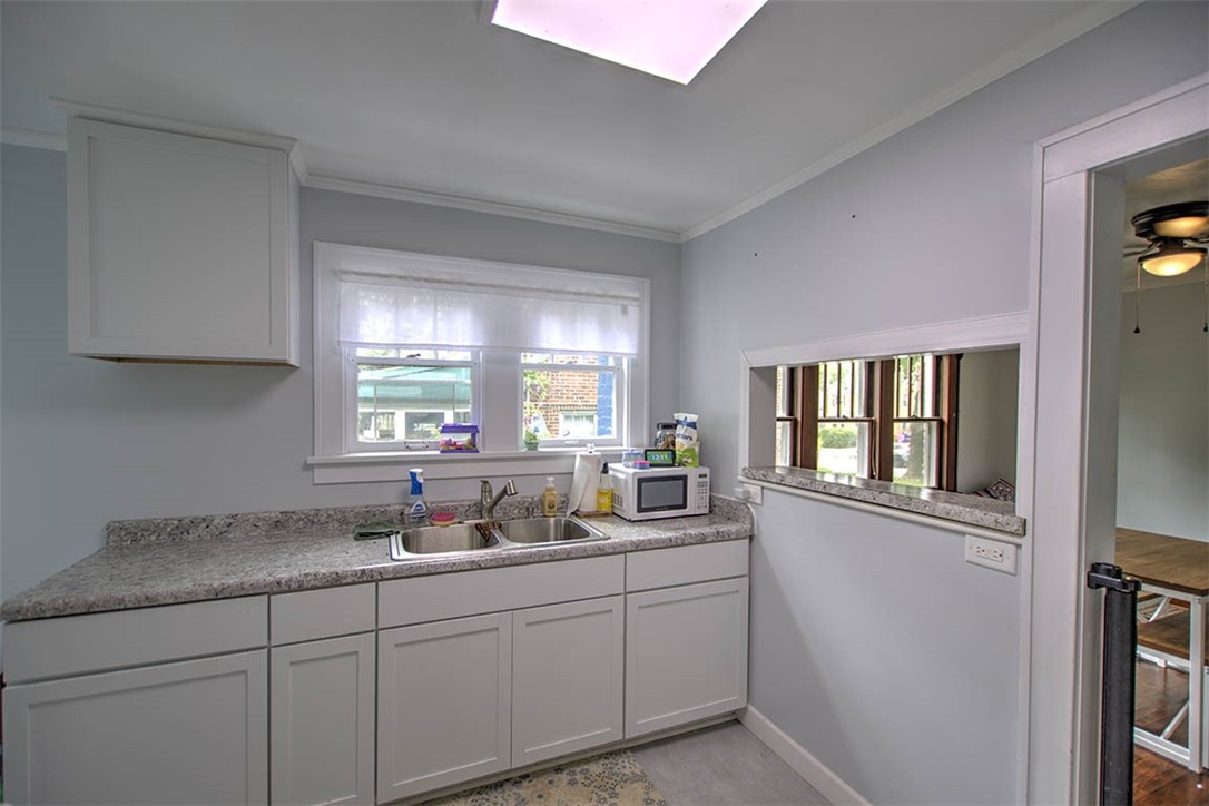 1344 West Sunset Avenue Decatur, IL 62522 - Photo 8 of 17 a kitchen with sink and window