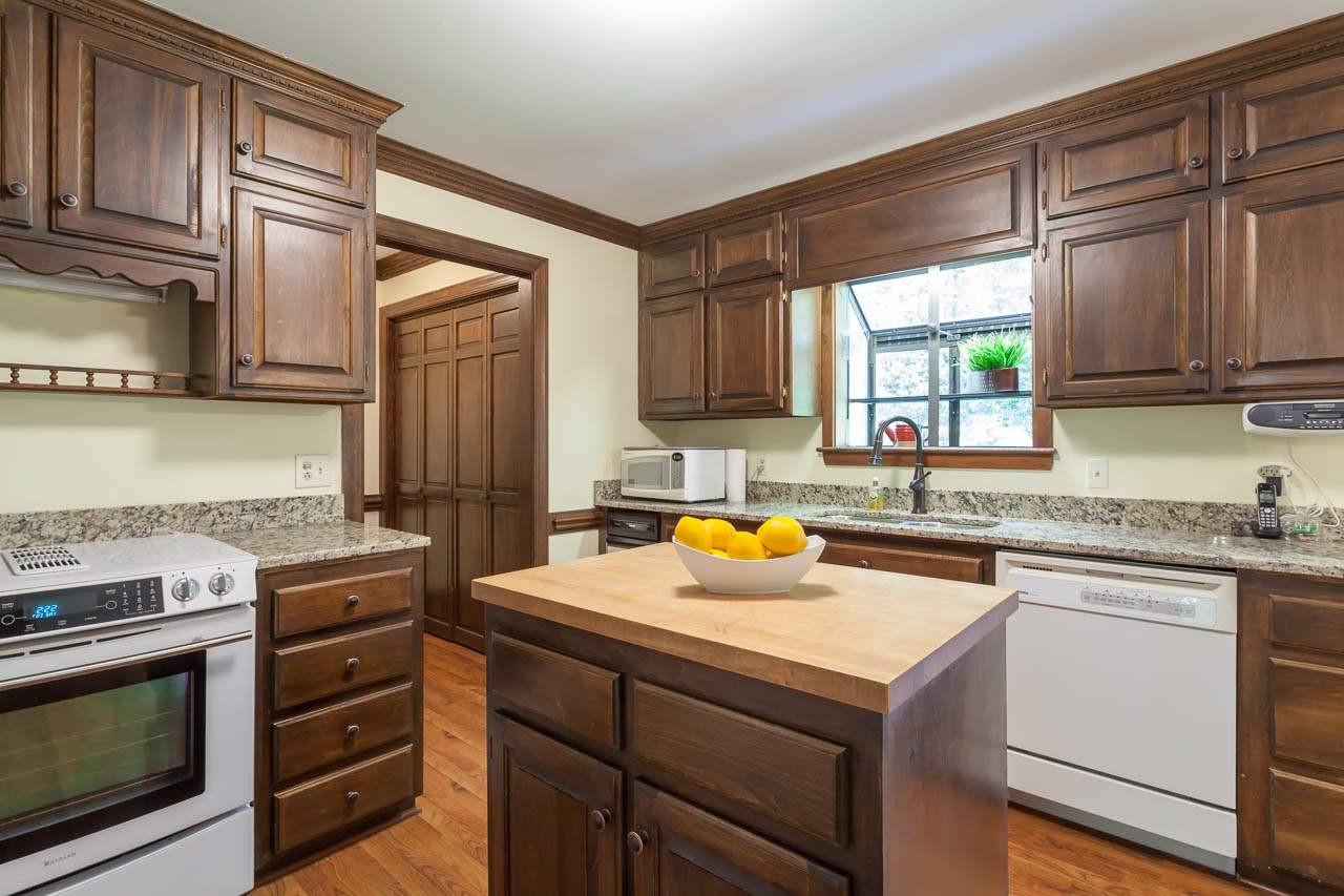 2901 Patrie Place Raleigh, NC 27613 - Photo 11 of 25 Kitchen features white appliances and nice garden bay window. Kitchen