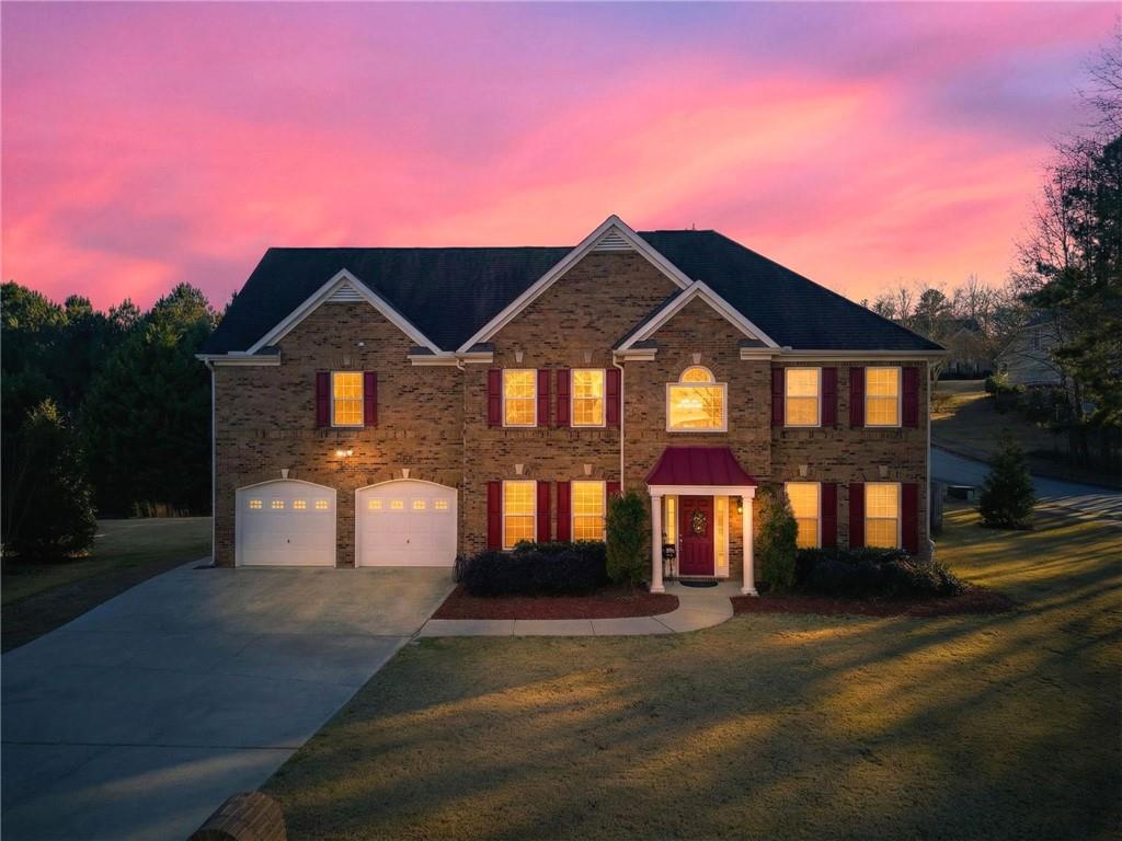 4817 Pepper Tree Lane Douglasville, GA 30135 - Photo 2 of 65 a front view of a house with a yard