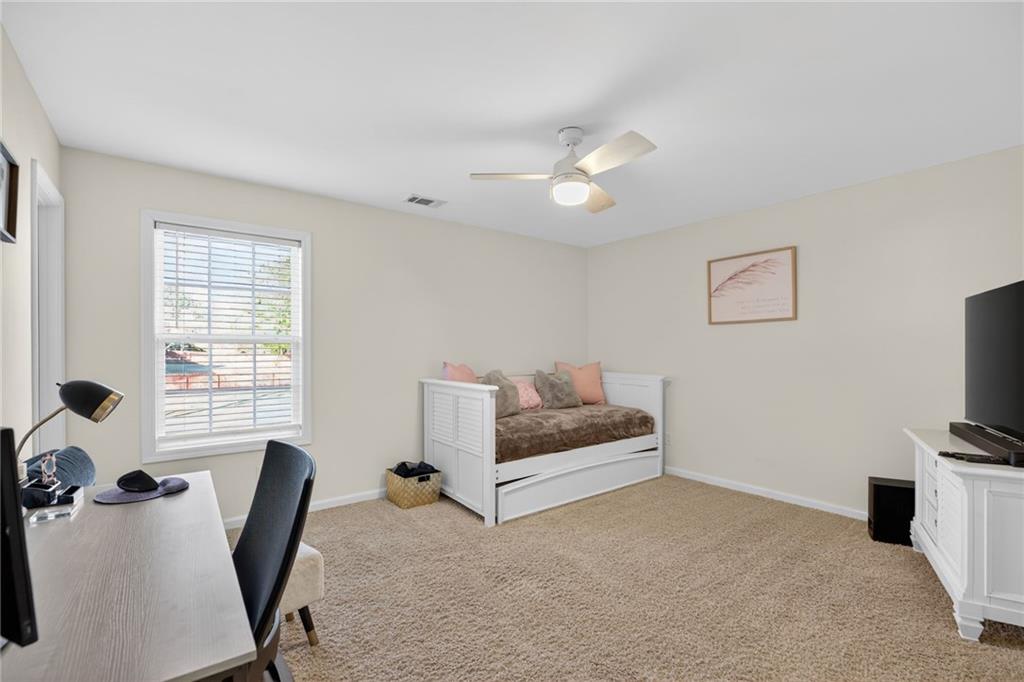 4817 Pepper Tree Lane Douglasville, GA 30135 - Photo 43 of 65 a bedroom with furniture and a window