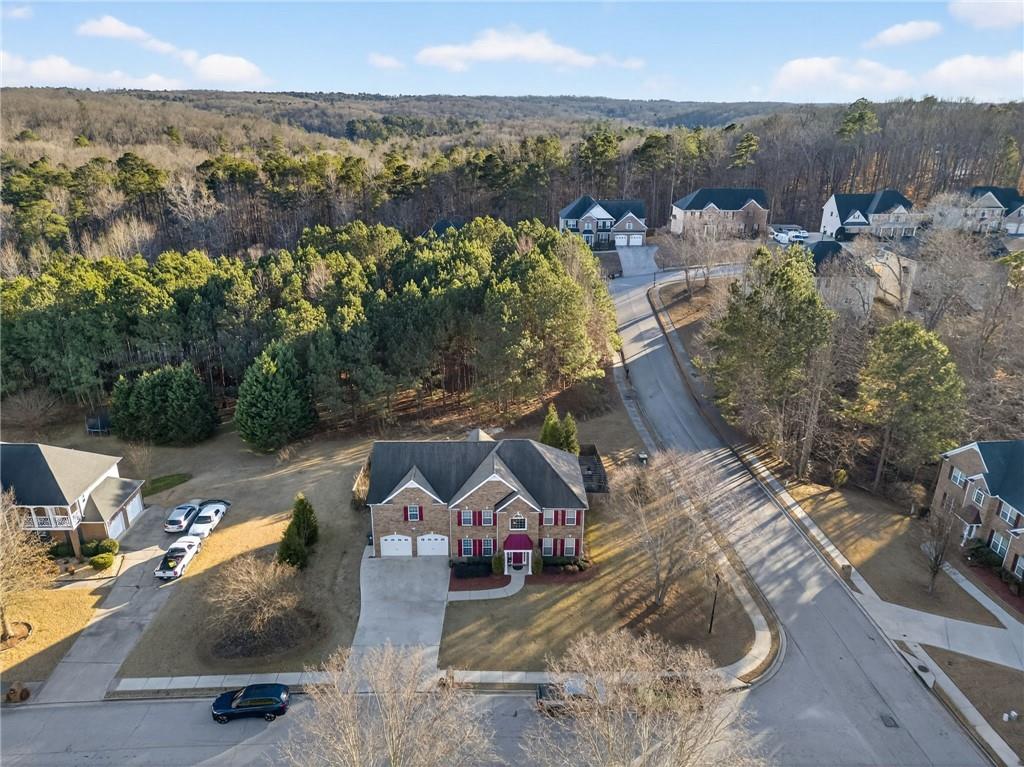 4817 Pepper Tree Lane Douglasville, GA 30135 - Photo 61 of 65 an aerial view of a house with a yard and lake view
