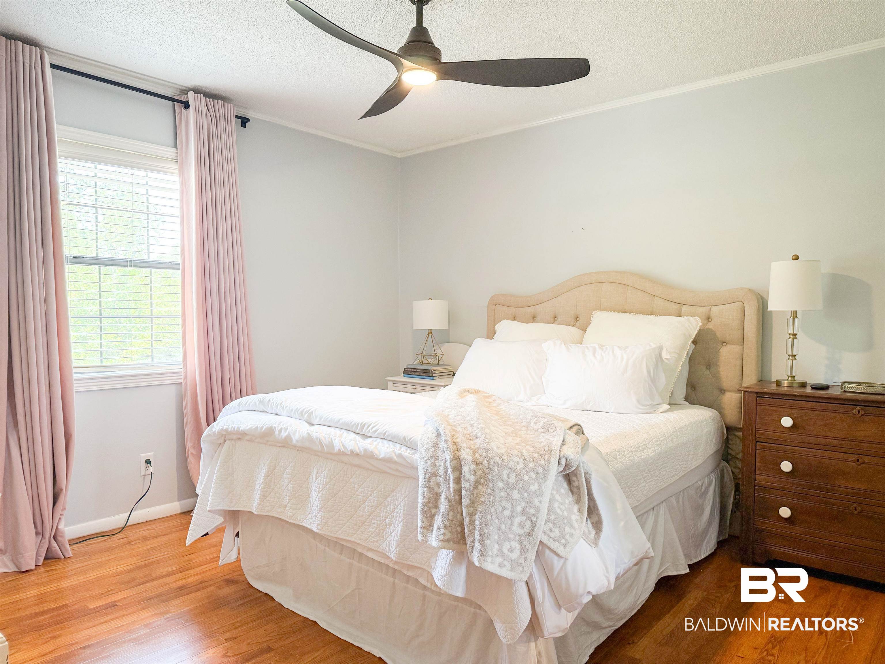 1508 Poplar Avenue Brewton, AL 36426 - Photo 13 of 22 Bedroom with wood finished floors, ornamental molding, ceiling fan, and a textured ceiling