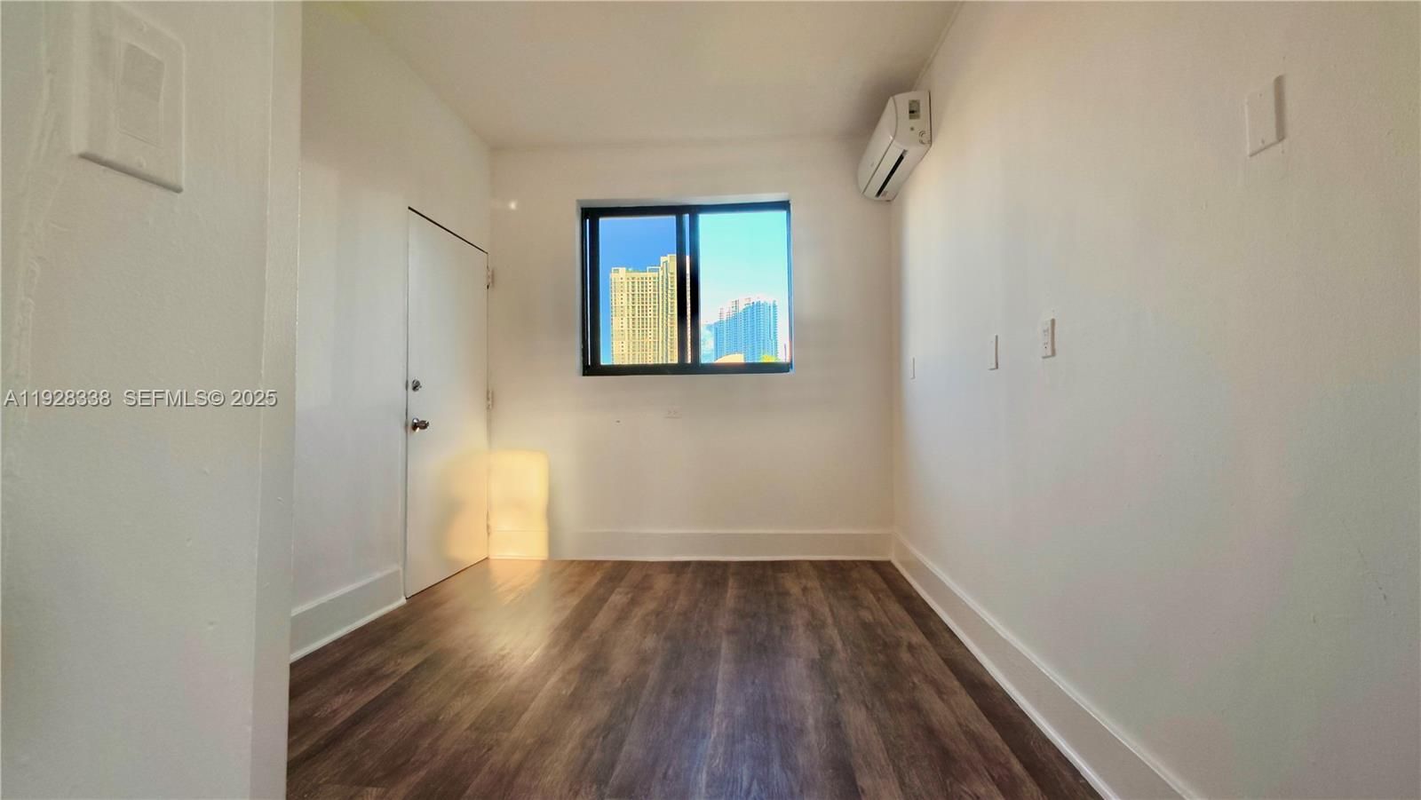 337 Southwest 5th Avenue, Unit 12 Miami, FL 33130 - Photo 16 of 21 a view of small space with wooden floor and a window