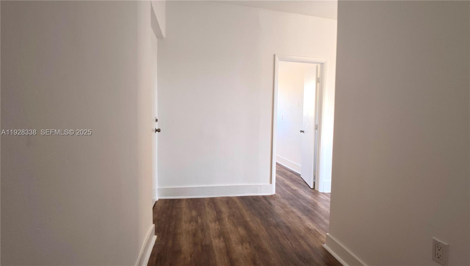 337 Southwest 5th Avenue, Unit 12 Miami, FL 33130 - Photo 18 of 21 a view of an empty room and wooden floor