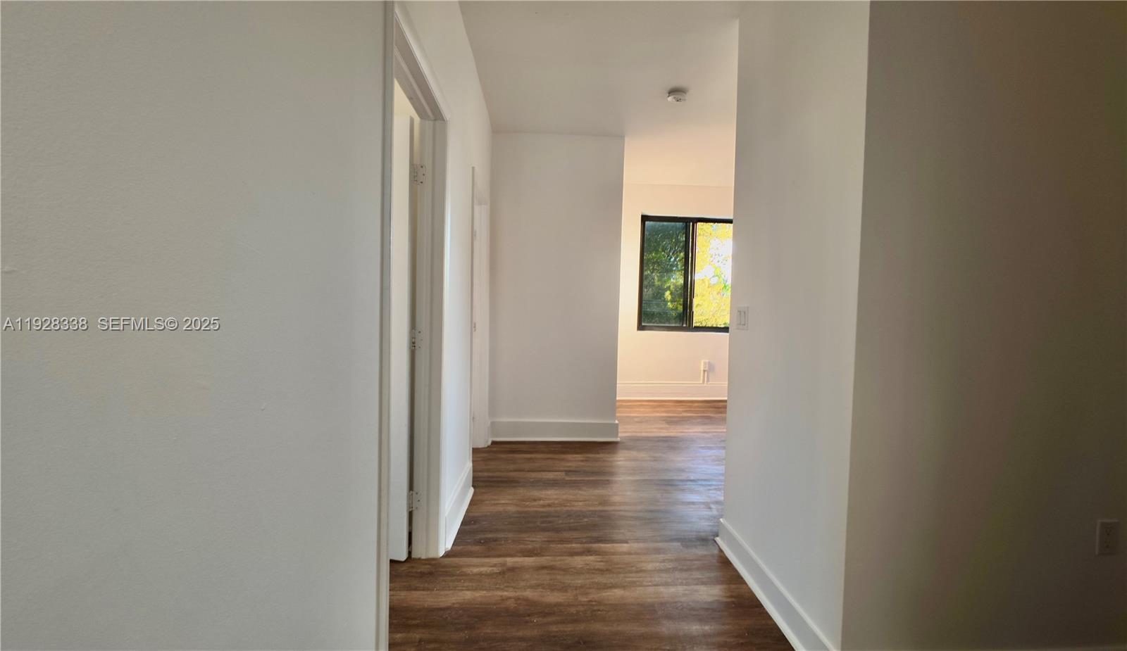 337 Southwest 5th Avenue, Unit 12 Miami, FL 33130 - Photo 5 of 21 a view of a hallway with wooden floor