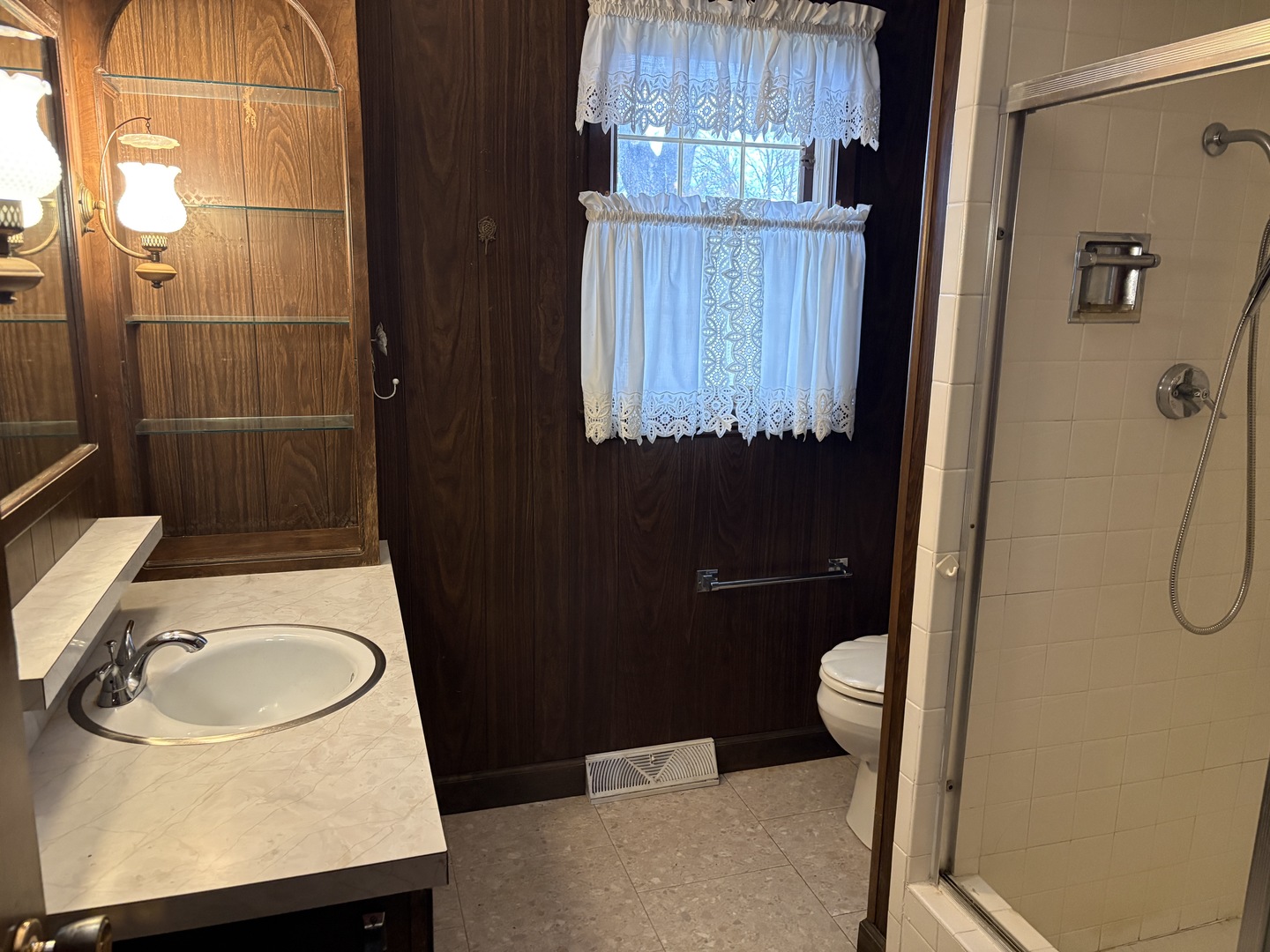 1740 Frazier Avenue Centralia, IL 62801 - Photo 11 of 12 a bathroom with a sink a toilet and shower
