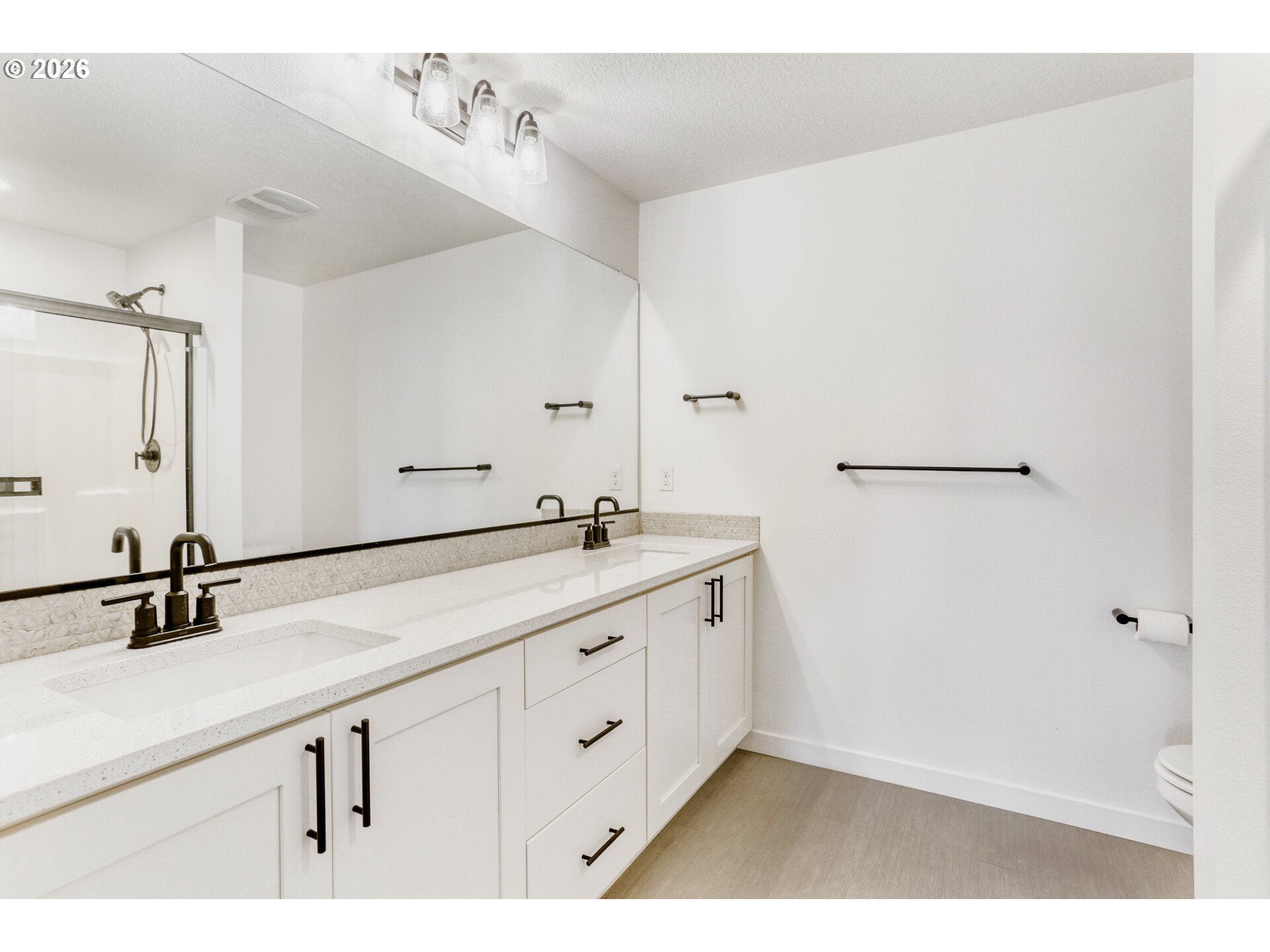 802 South 25th Avenue Cornelius, OR 97113 - Photo 22 of 30 a bathroom with a double vanity sink and mirror