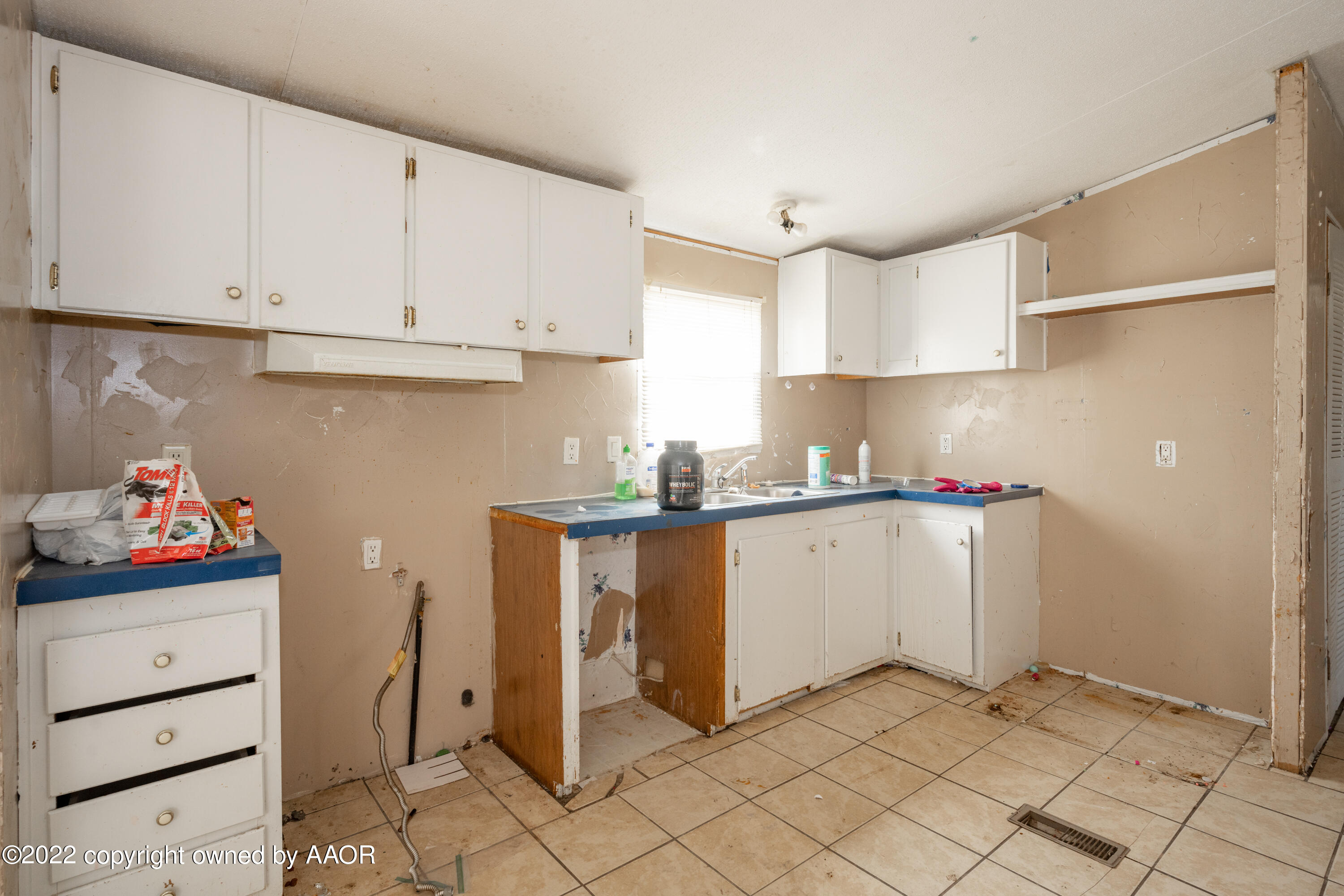 2206 Wheatstraw Road Amarillo, TX 79118 - Photo 6 of 15 a kitchen with cabinets and window