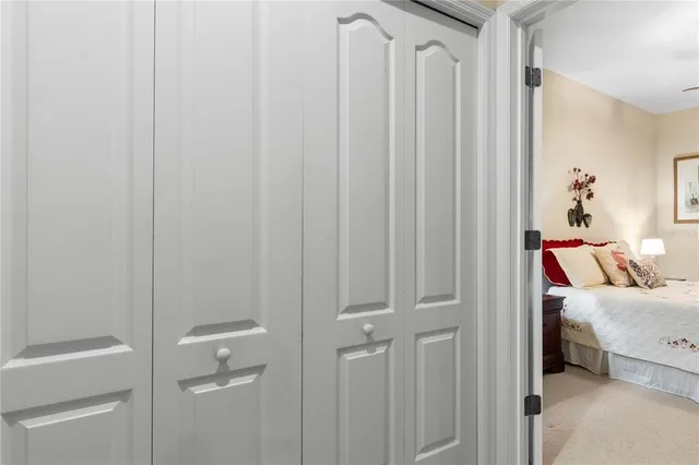 a bathroom with a sink a toilet a mirror a bathtub and shower