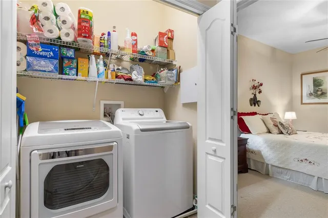 a kitchen with stainless steel appliances granite countertop a refrigerator stove and microwave