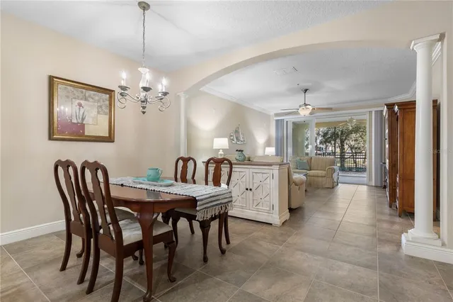 a view of a house with pool and sitting area