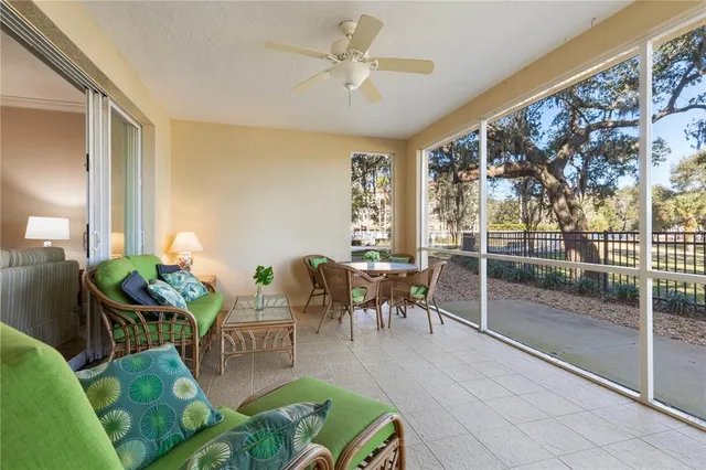 a view of a hallway with wooden floor and a bed
