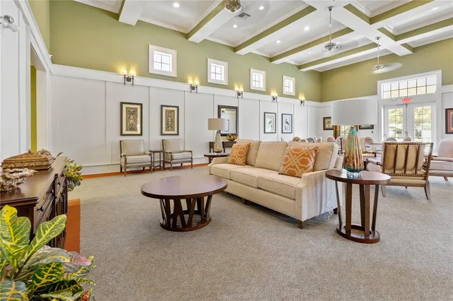 a view of a swimming pool with a table and chairs