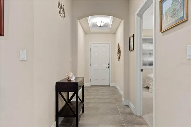 a view of a bedroom with a bed and furniture