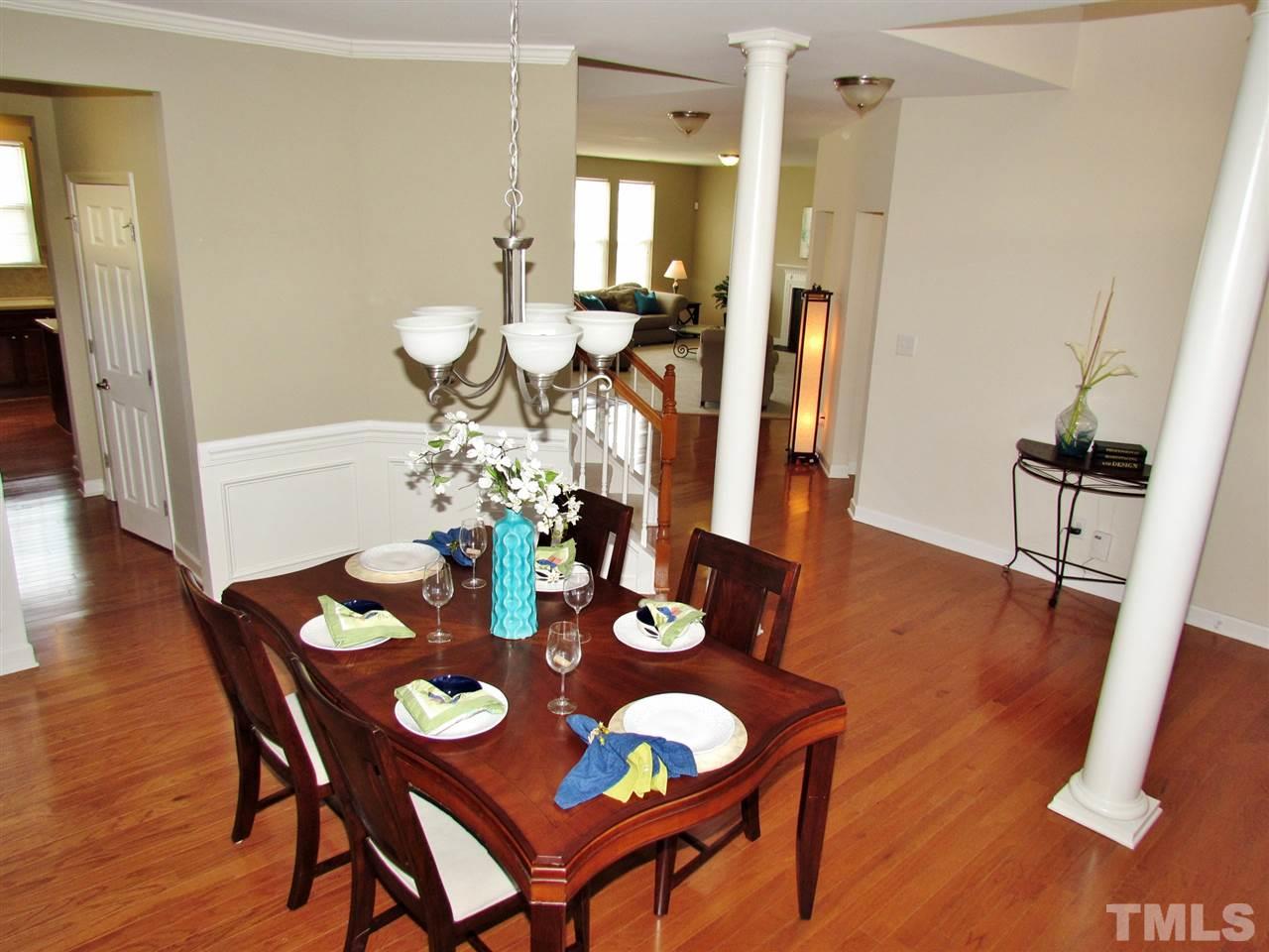 5148 Holly Ridge Farm Road Raleigh, NC 27616 - Photo 3 of 25 a view of a dining room with furniture and wooden floor