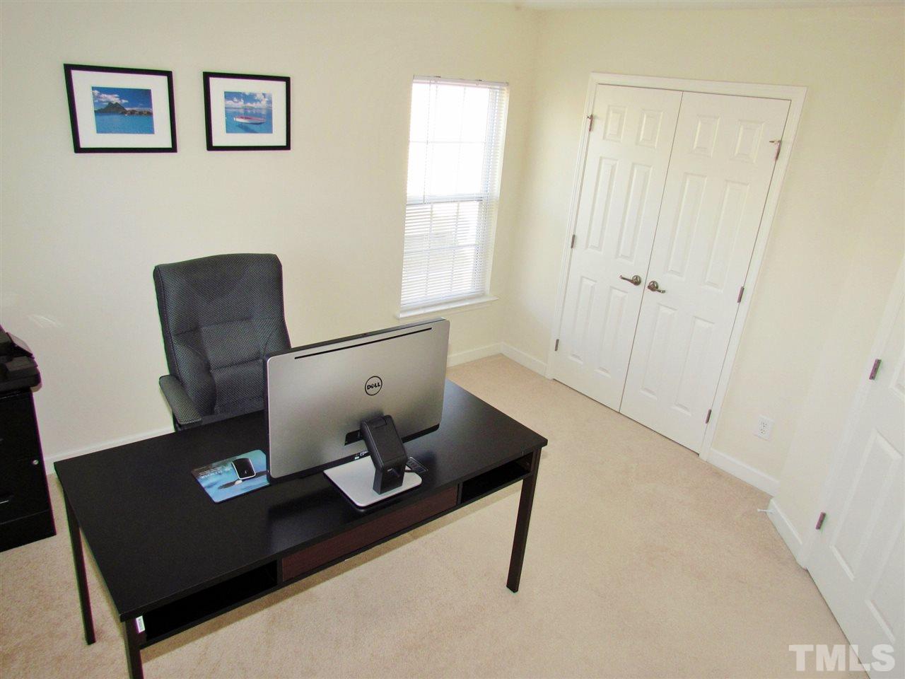 5148 Holly Ridge Farm Road Raleigh, NC 27616 - Photo 22 of 25 a living room with chair and a window