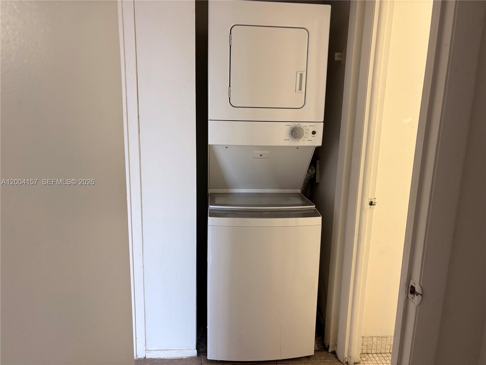 4168 Inverrary Drive, Unit 408 Lauderhill, FL 33319 - Photo 4 of 11 a utility room with dryer and washer
