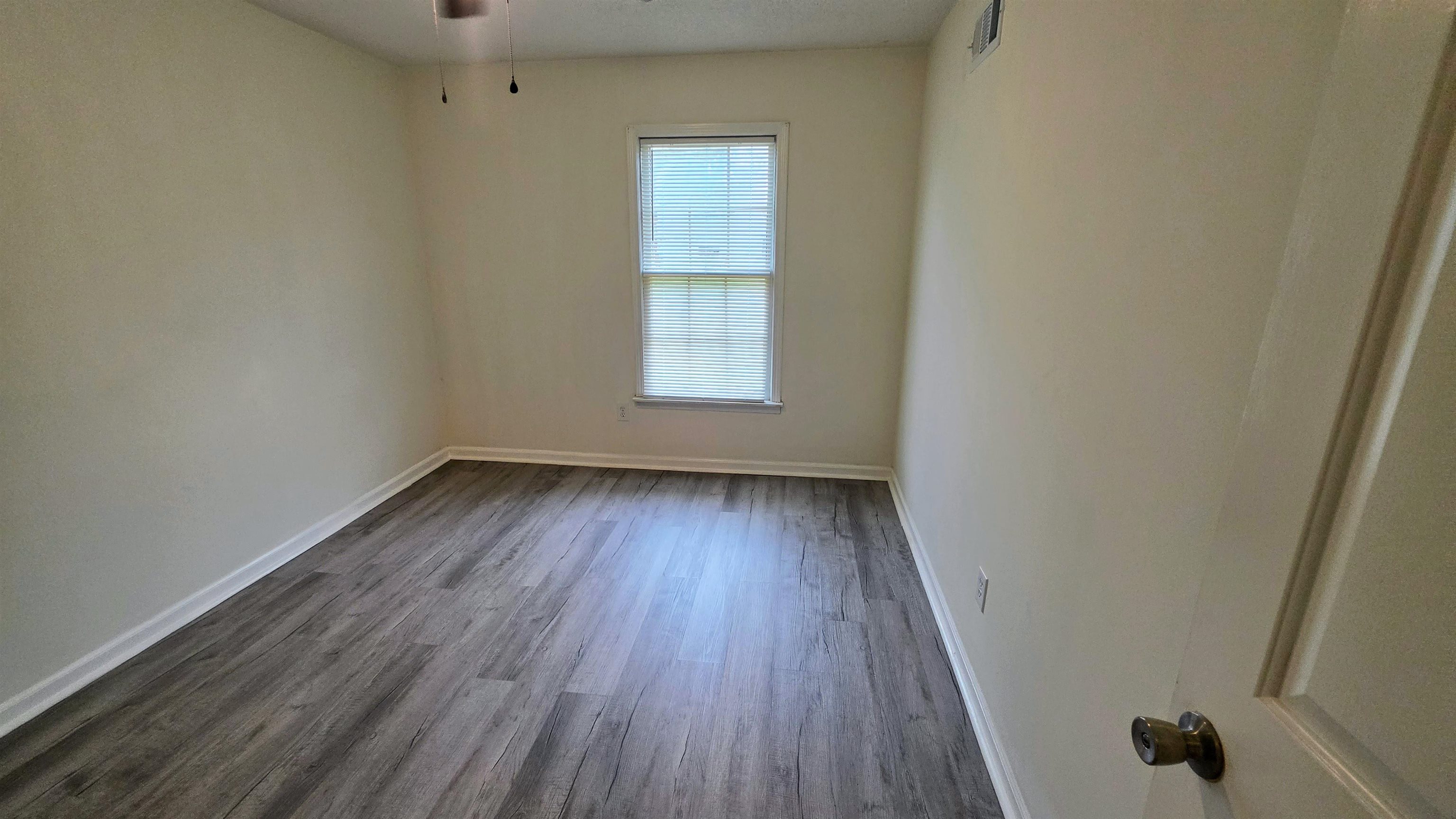 4264 Timber Rise Road Memphis, TN 38125 - Photo 26 of 32 Unfurnished bedroom featuring light wood-style flooring and baseboards