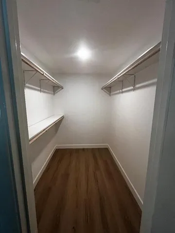 a bathroom with a double vanity sink and mirror