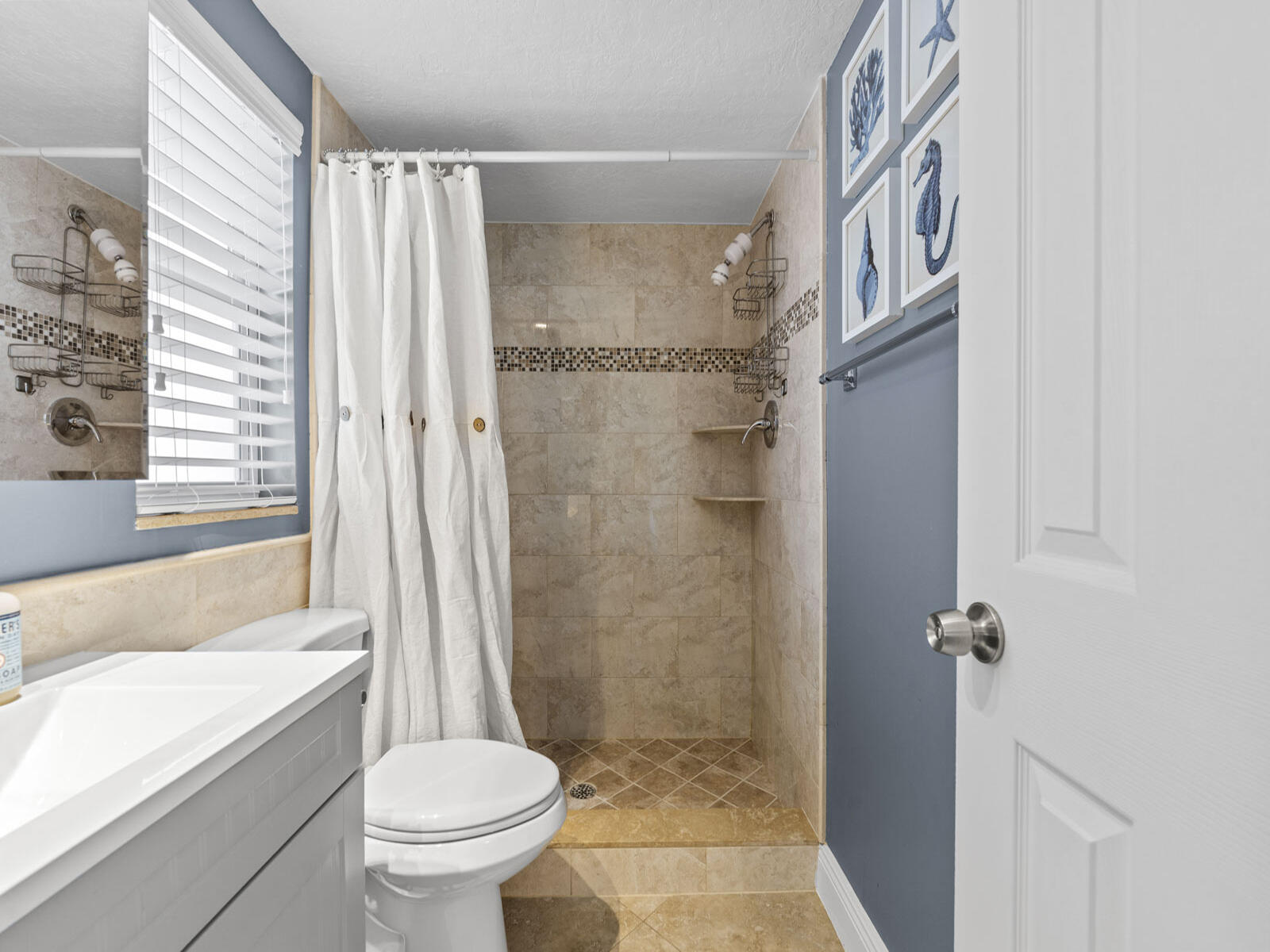 40 High Point Road, Unit D102 Tavernier, FL 33070 - Photo 22 of 37 a bathroom with a toilet and a shower