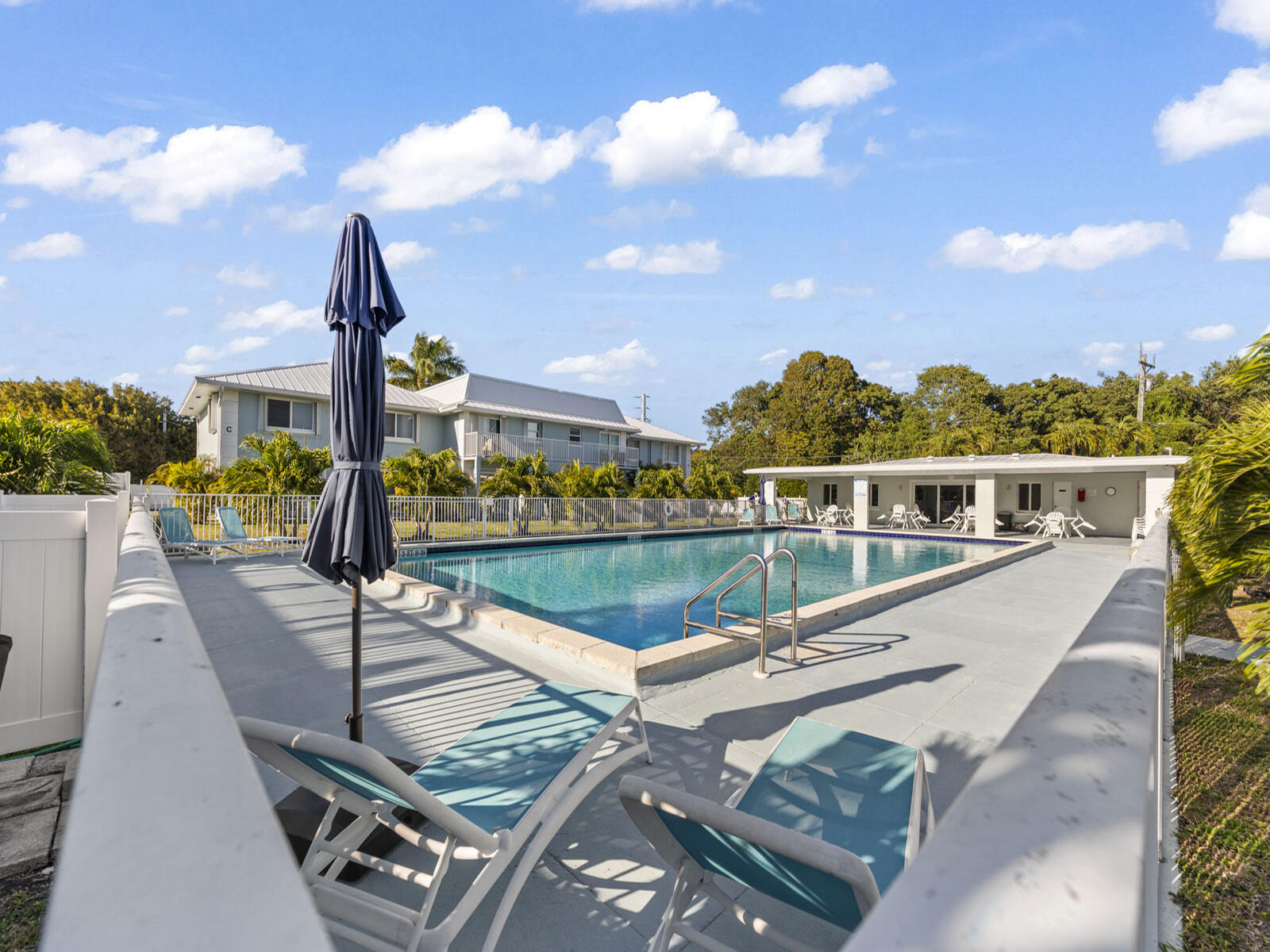 40 High Point Road, Unit D102 Tavernier, FL 33070 - Photo 27 of 37 a view of swimming pool with seating area