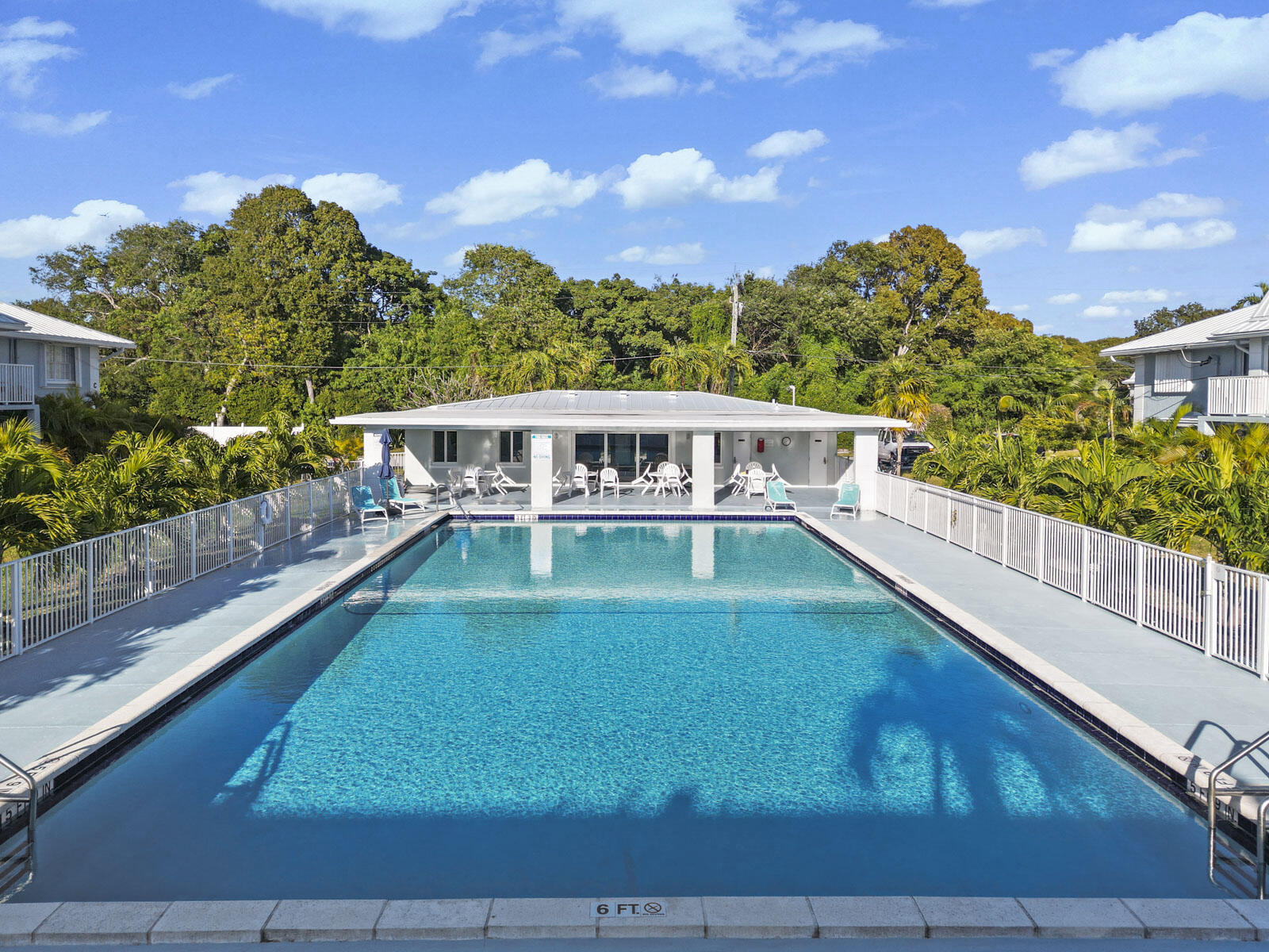 40 High Point Road, Unit D102 Tavernier, FL 33070 - Photo 28 of 37 a view of a swimming pool with a deck