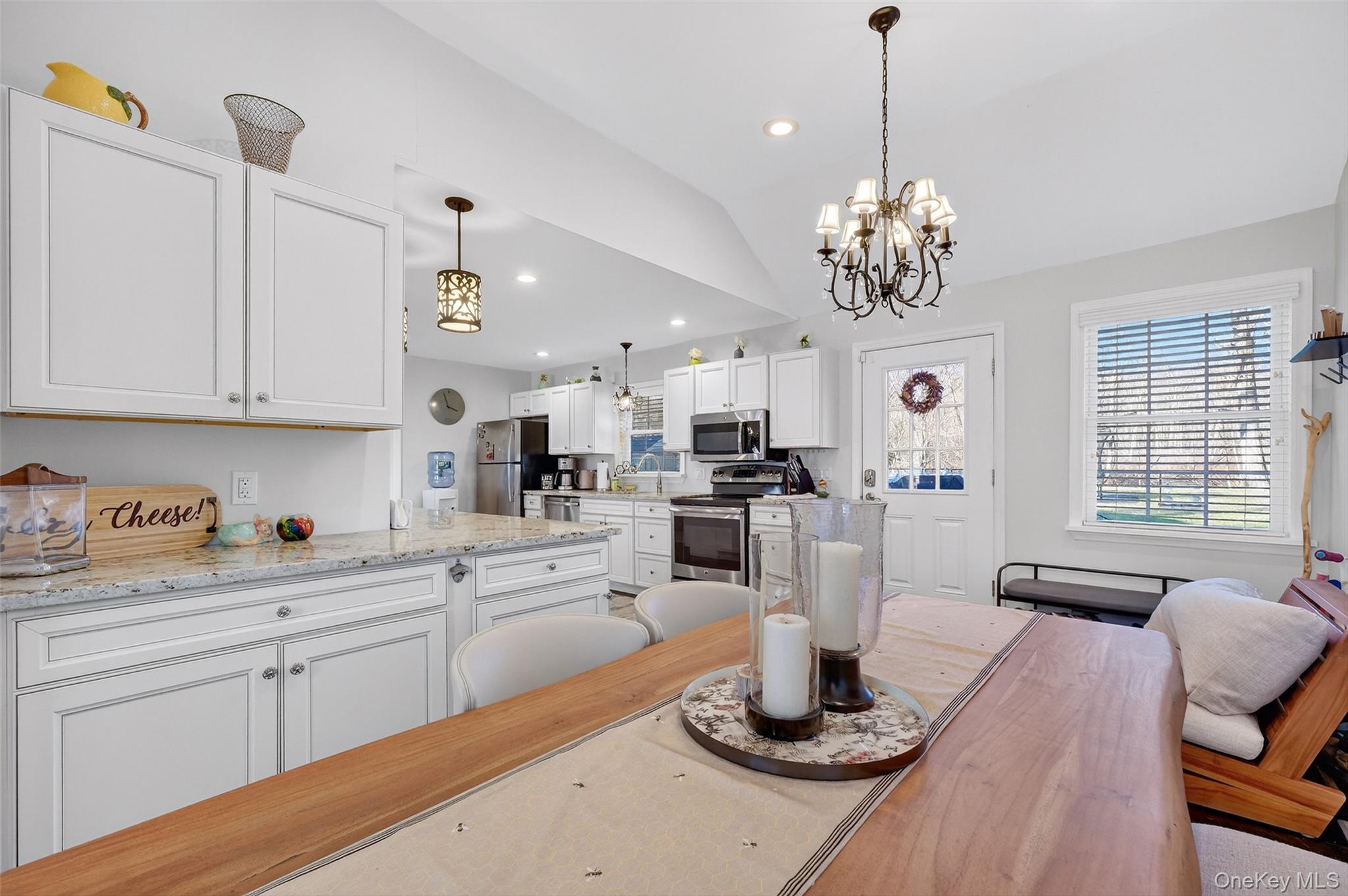 550 Beach Road Mahopac, NY 10541 - Photo 15 of 38 a kitchen with stainless steel appliances granite countertop a stove and white cabinets