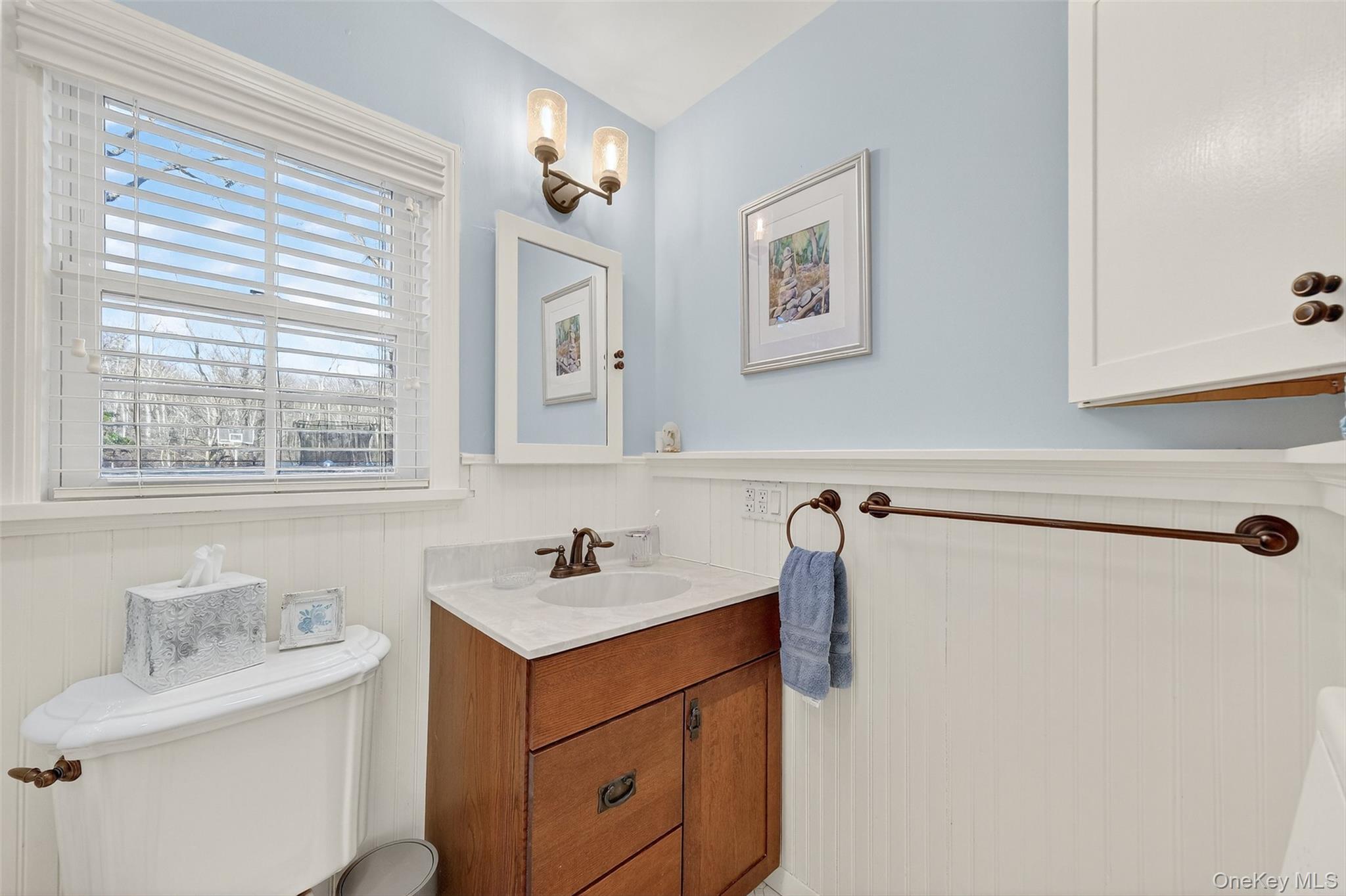 550 Beach Road Mahopac, NY 10541 - Photo 18 of 38 a bathroom with a sink and a mirror