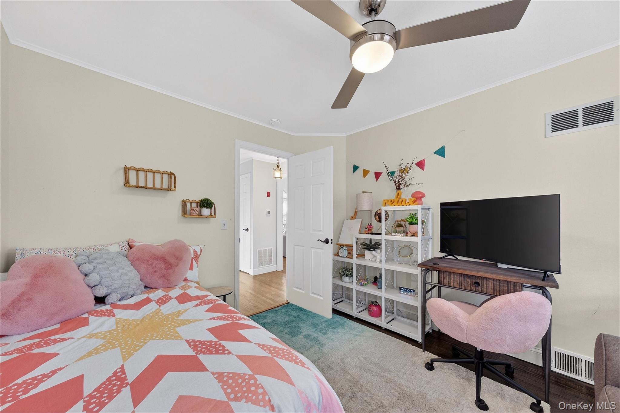 550 Beach Road Mahopac, NY 10541 - Photo 21 of 38 a bedroom with a bed and a flat screen tv