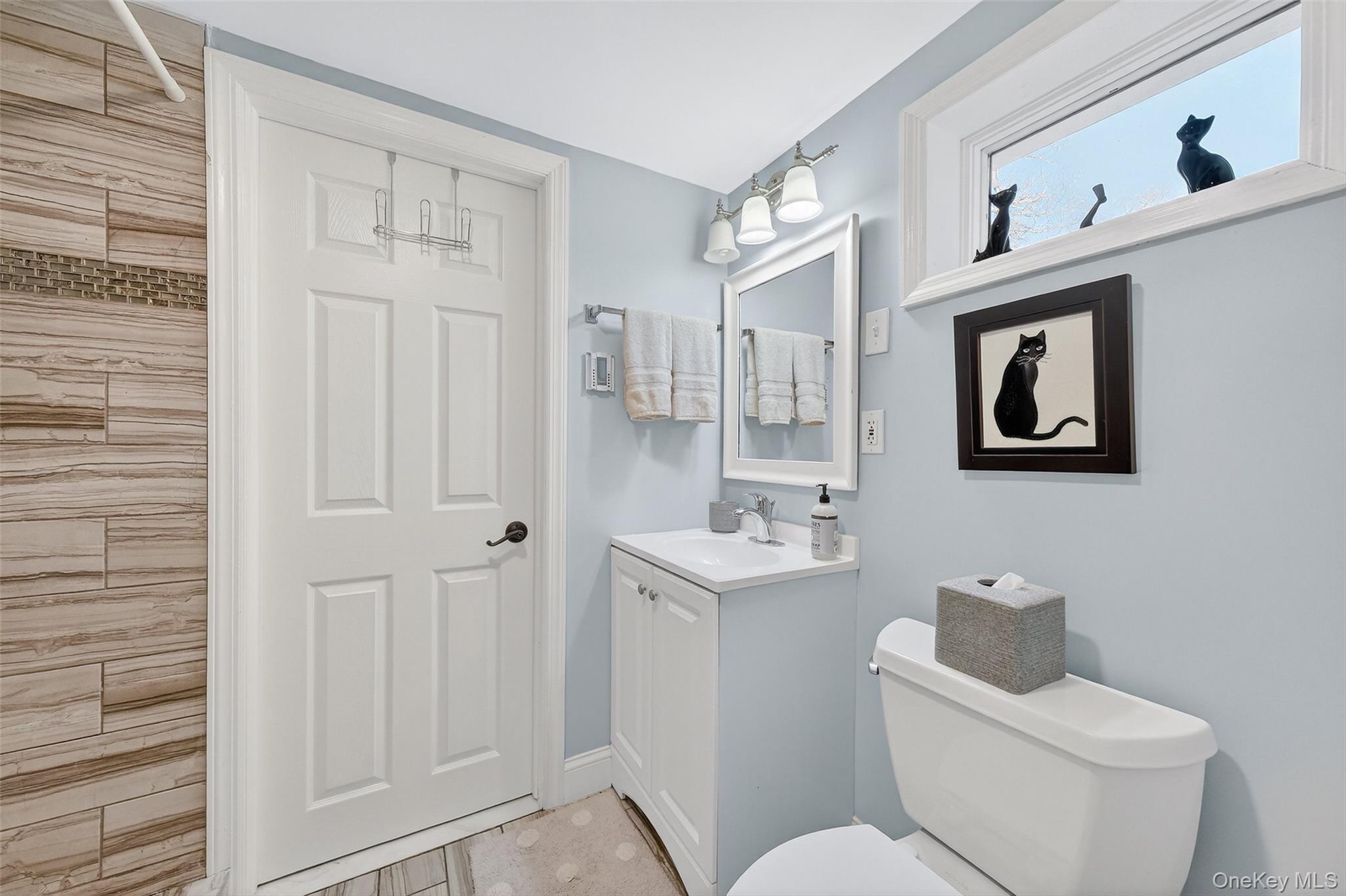 550 Beach Road Mahopac, NY 10541 - Photo 22 of 38 a white toilet sitting next to a bathroom sink