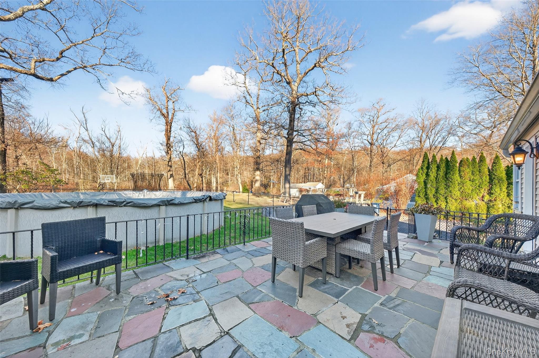 550 Beach Road Mahopac, NY 10541 - Photo 25 of 38 a view of a patio with a table and chairs
