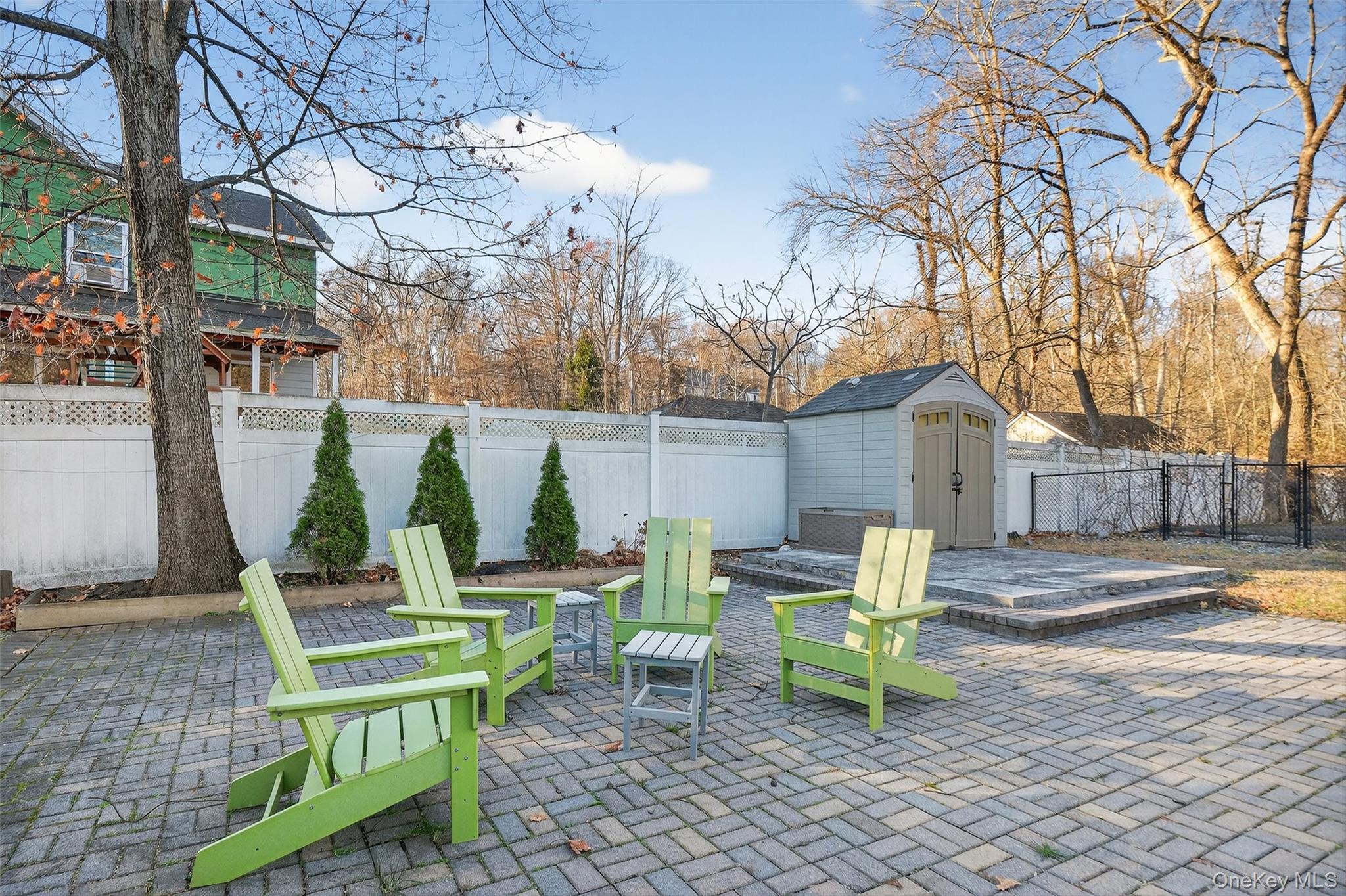550 Beach Road Mahopac, NY 10541 - Photo 26 of 38 a view of a chairs and table in backyard of the house