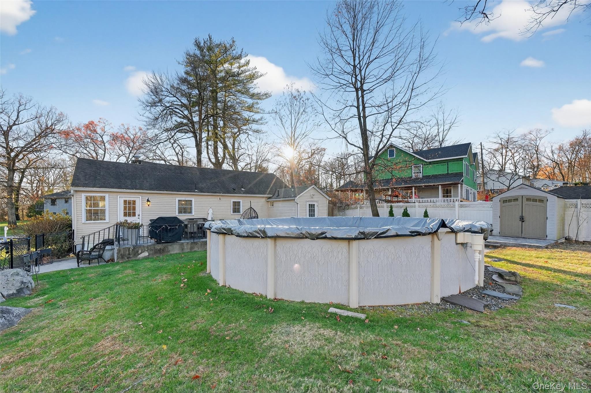 550 Beach Road Mahopac, NY 10541 - Photo 28 of 38 a view of a house with backyard and sitting area