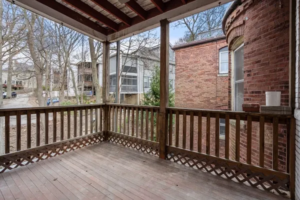 a balcony with wooden floor