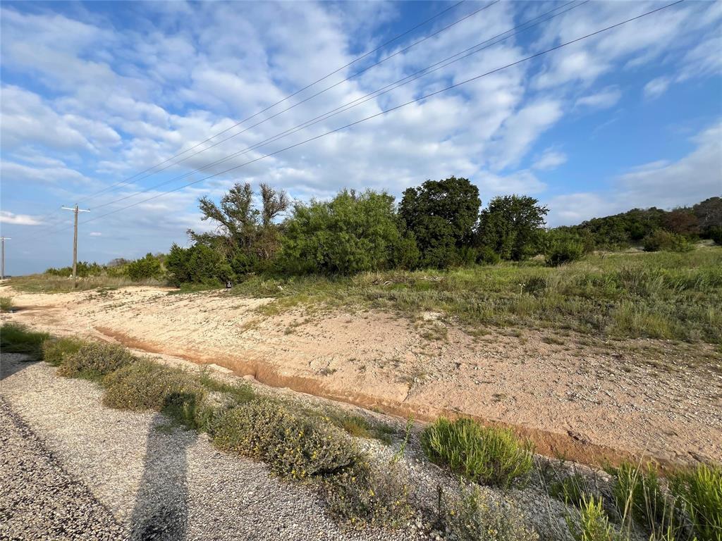 2245 Hidden Vly Road Glen Rose, TX 76043 - Photo 4 of 9 a view of a yard with an empty space