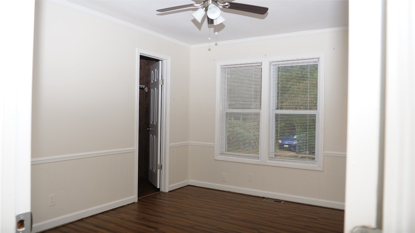 1504 Citation Circle, Unit D Del Valle, TX 78617 - Photo 12 of 25 a view of an empty room with wooden floor and a window