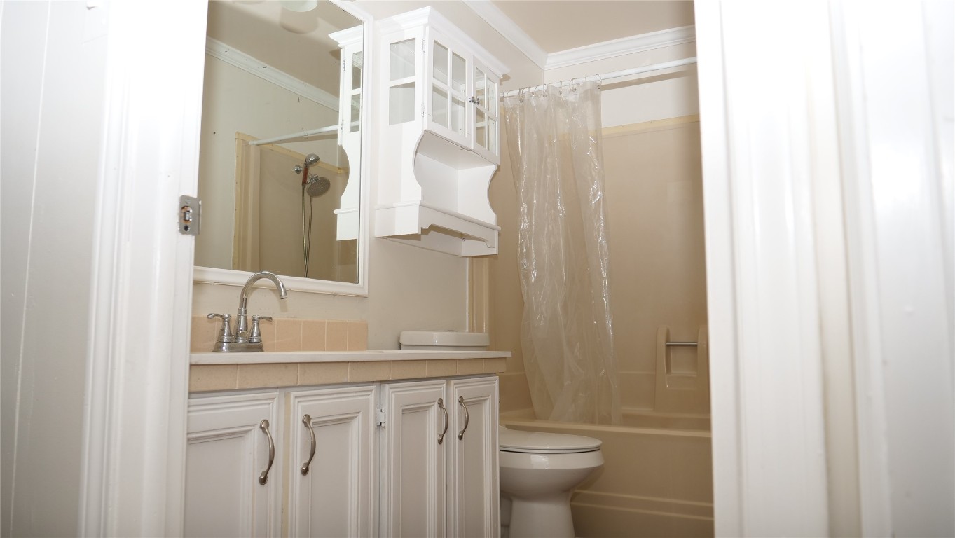 1504 Citation Circle, Unit D Del Valle, TX 78617 - Photo 13 of 25 a bathroom with a granite countertop sink toilet and shower