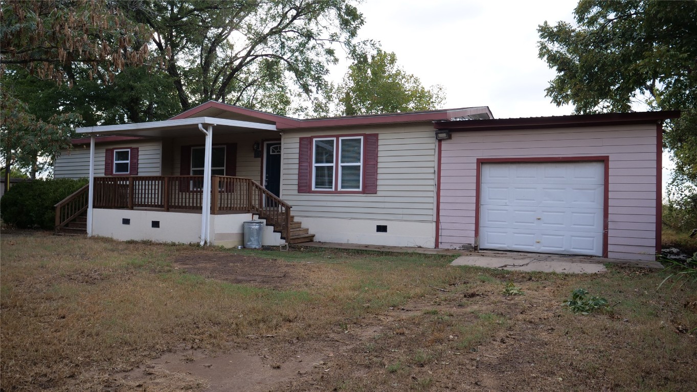 1504 Citation Circle, Unit D Del Valle, TX 78617 - Photo 18 of 25 a view of a house with a backyard
