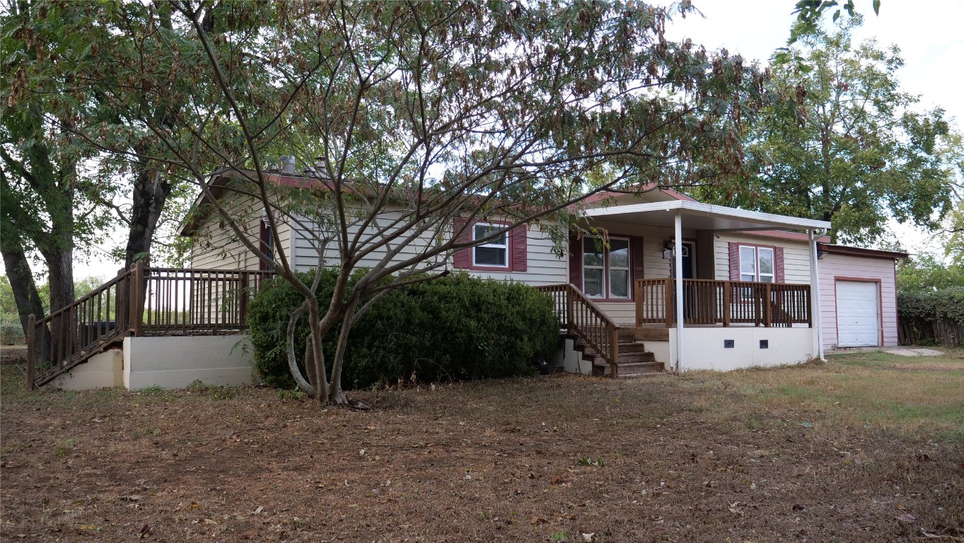 1504 Citation Circle, Unit D Del Valle, TX 78617 - Photo 19 of 25 a view of a house with a yard