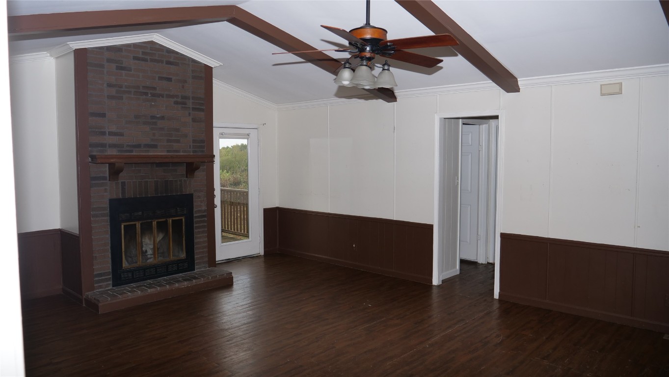 1504 Citation Circle, Unit D Del Valle, TX 78617 - Photo 4 of 25 a living room with wooden floor and a fireplace