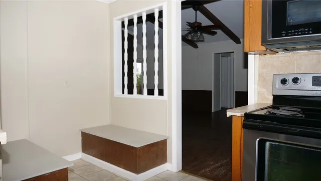 a kitchen with stainless steel appliances a stove and a refrigerator
