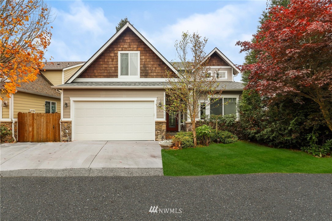 2013 Northeast 15th Street Renton, WA 98056 - Photo 1 of 29 a front view of a house with a yard and garage