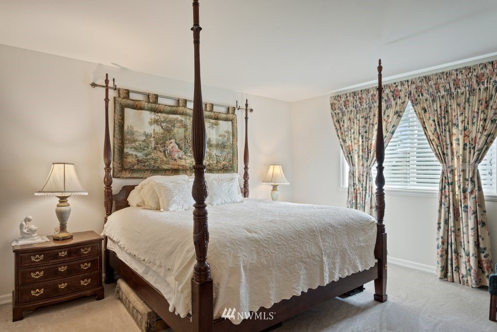 2013 Northeast 15th Street Renton, WA 98056 - Photo 16 of 29 a bedroom with a bed and a mirror